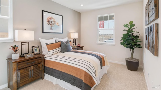 bedroom featuring light carpet