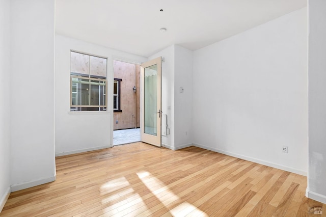 spare room featuring light hardwood / wood-style floors