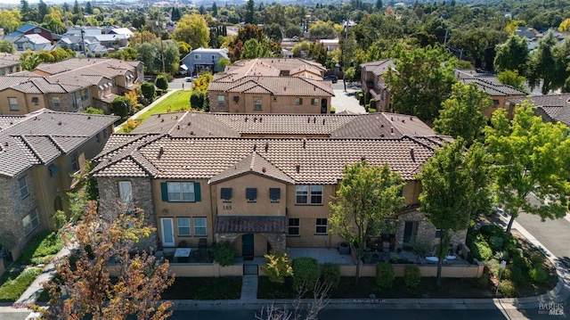 birds eye view of property with a residential view