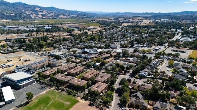 birds eye view of property with a mountain view