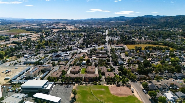 drone / aerial view featuring a residential view and a mountain view