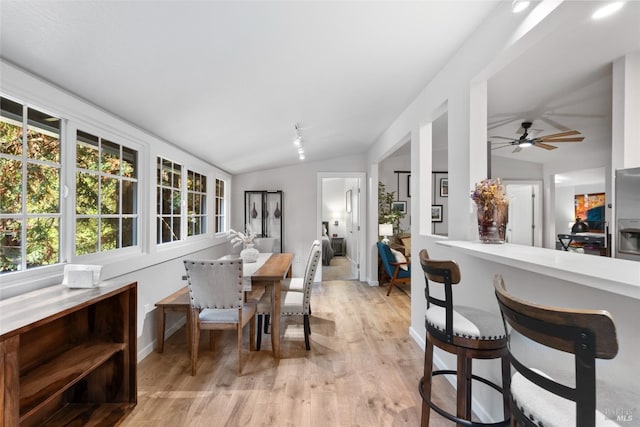 interior space featuring lofted ceiling and light wood finished floors