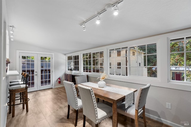 sunroom / solarium with vaulted ceiling and french doors