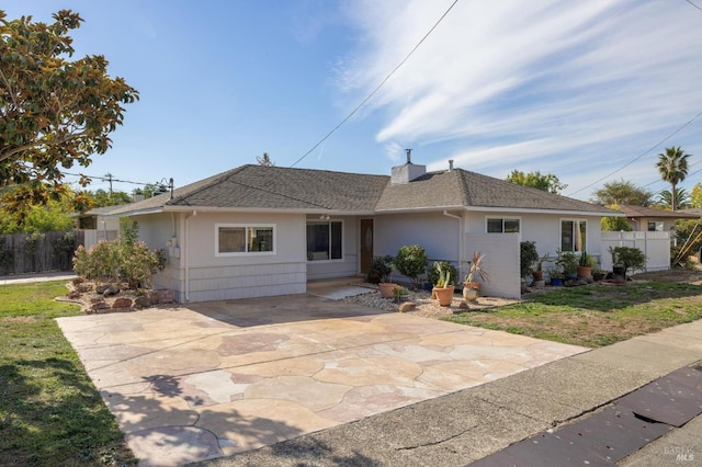 ranch-style house with a patio area