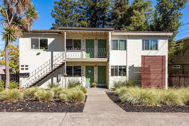 512 Kentucky St, Petaluma, CA 94952 - view of front facade with stairway, fence, and stucco siding