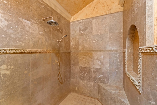 details with ornamental molding and a tile shower