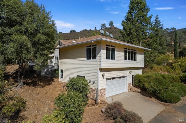 view of side of home with a garage