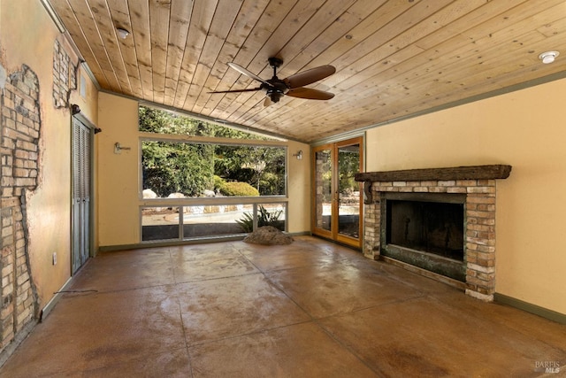 view of patio with ceiling fan and a brick fireplace