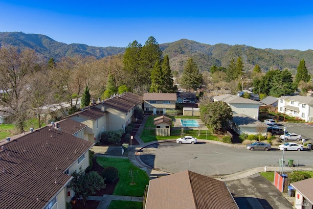 birds eye view of property with a mountain view