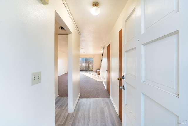 hallway featuring light hardwood / wood-style floors