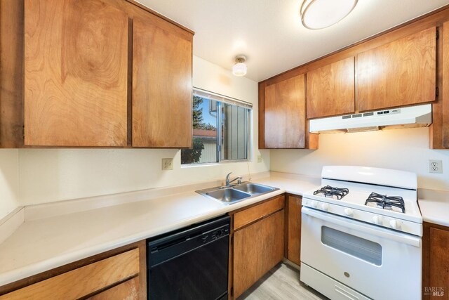 kitchen with white range with gas stovetop, light hardwood / wood-style floors, dishwasher, and sink