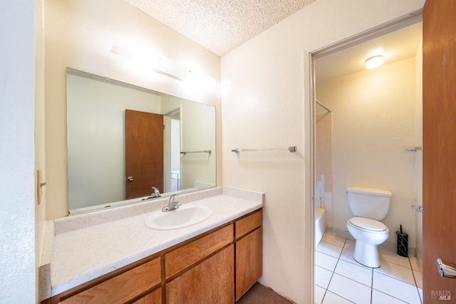 full bathroom featuring tile patterned floors, a textured ceiling, toilet, vanity, and shower / bathtub combination