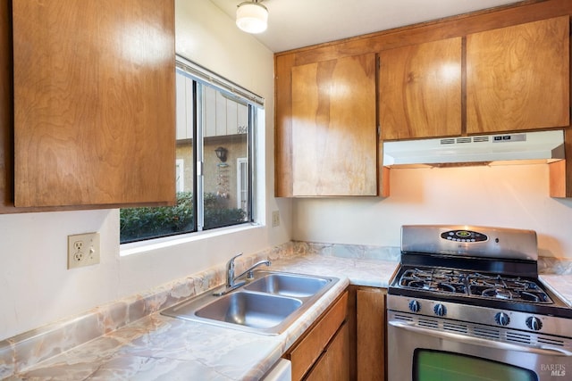 kitchen featuring stainless steel range with gas cooktop and sink