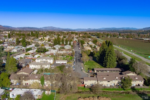 birds eye view of property with a mountain view