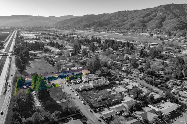 birds eye view of property featuring a mountain view