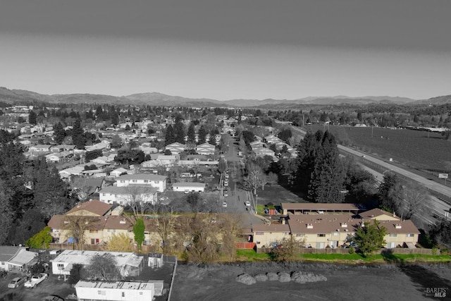 birds eye view of property with a mountain view