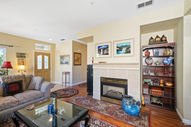 living room with a fireplace and hardwood / wood-style flooring