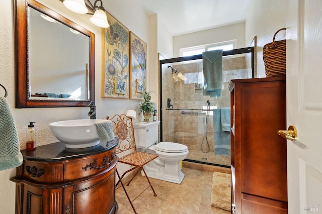 bathroom with vanity, toilet, and an enclosed shower