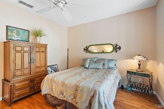 bedroom with hardwood / wood-style floors and ceiling fan