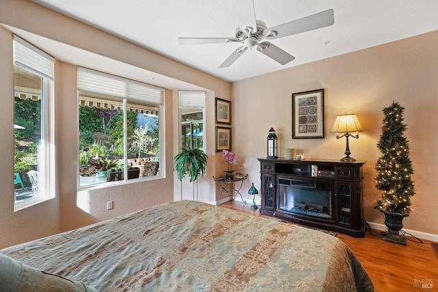 bedroom with ceiling fan and hardwood / wood-style floors