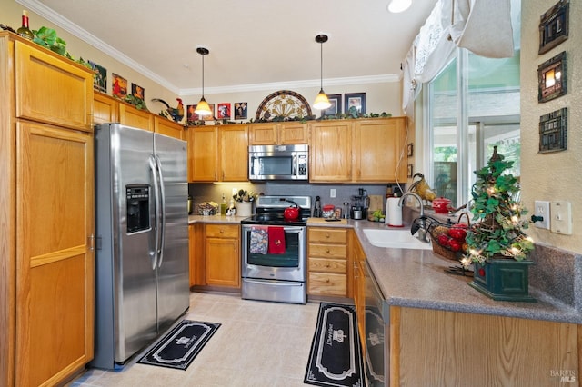 kitchen featuring sink, ornamental molding, decorative light fixtures, light tile patterned flooring, and stainless steel appliances