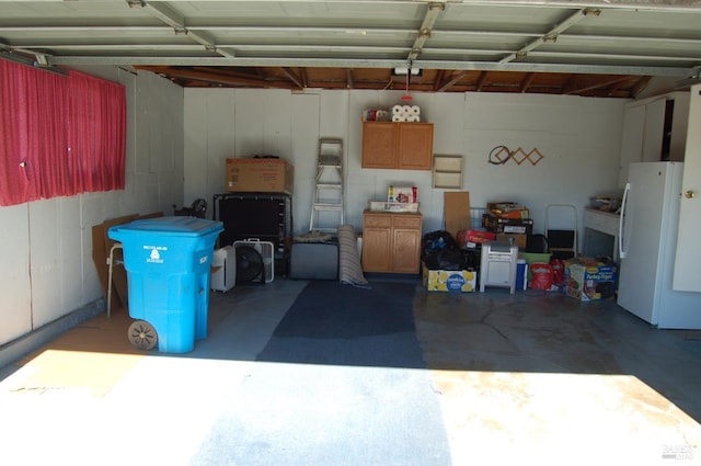 garage featuring white refrigerator