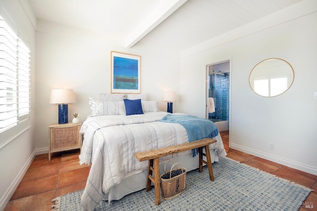 tiled bedroom with beamed ceiling, baseboards, and connected bathroom