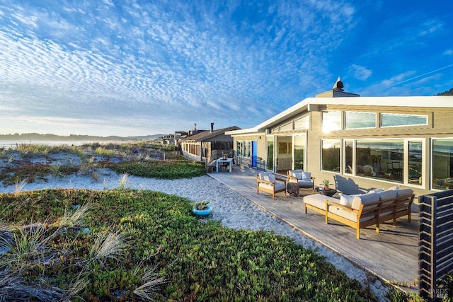 rear view of property with a patio and an outdoor hangout area