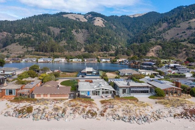 aerial view featuring a water and mountain view