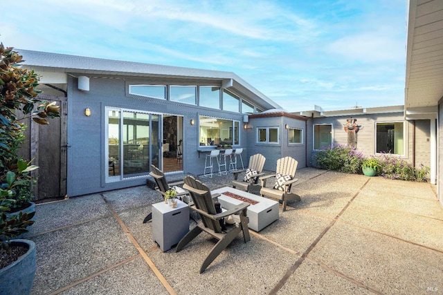 view of patio / terrace with a fire pit