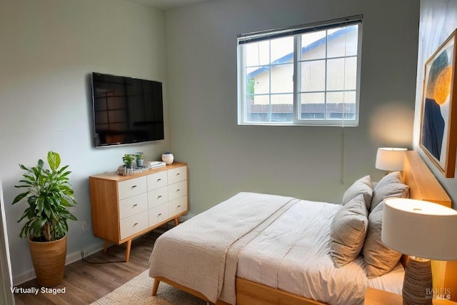 bedroom with light wood-type flooring