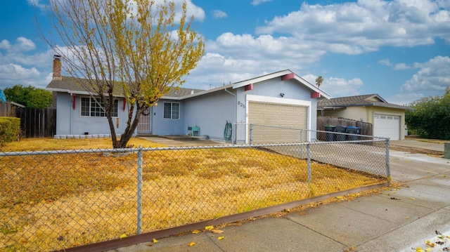 single story home featuring driveway, a fenced front yard, a chimney, an attached garage, and stucco siding