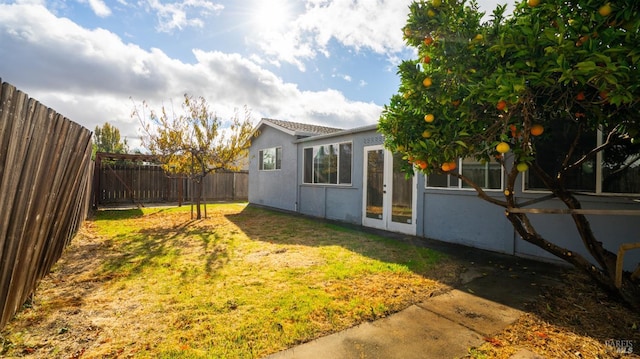 view of yard featuring french doors