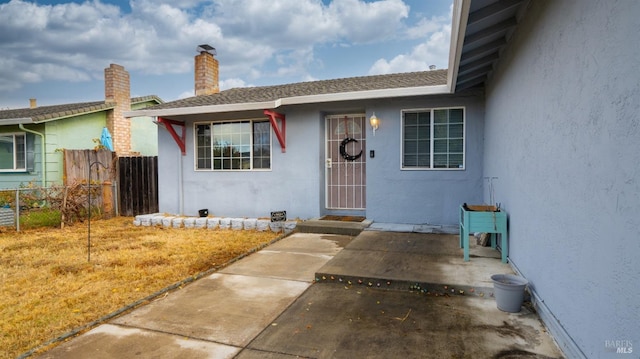 entrance to property with a patio