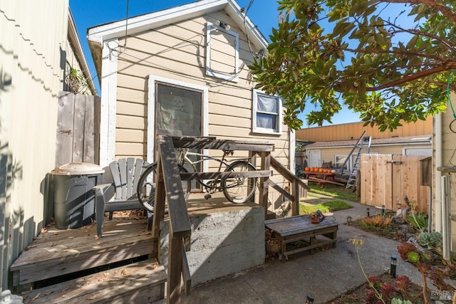 exterior space with fence and a wooden deck