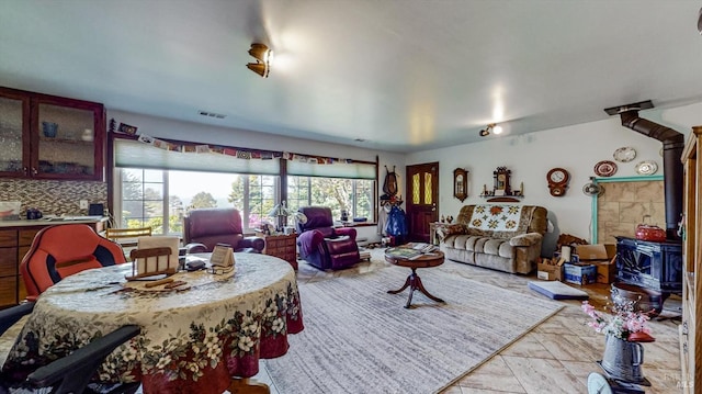 living room featuring a wood stove