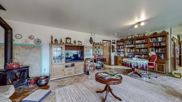 living room with a wood stove