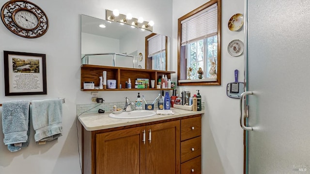 bathroom with vanity and an enclosed shower