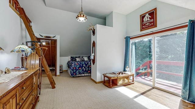 interior space featuring lofted ceiling and access to outside