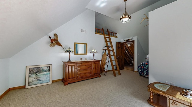 interior space featuring light carpet and vaulted ceiling