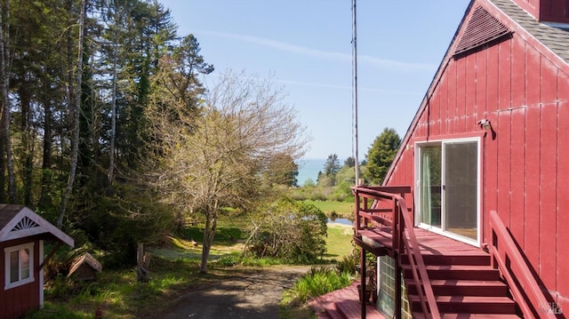 view of side of home with a deck