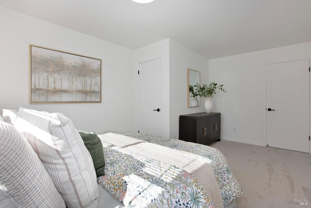 bedroom with carpet and baseboards