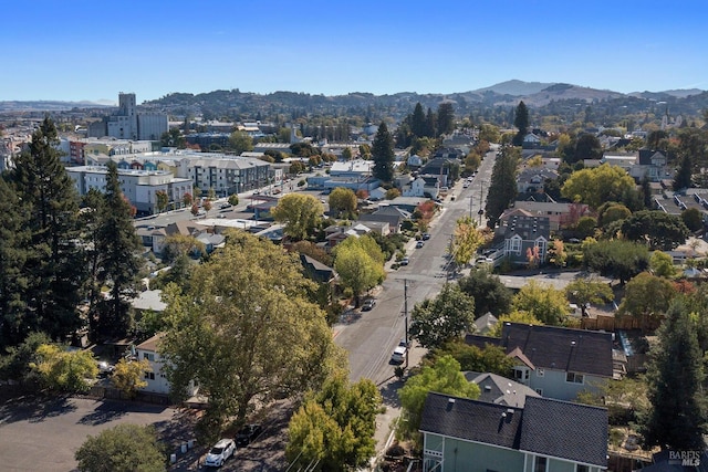 birds eye view of property with a mountain view