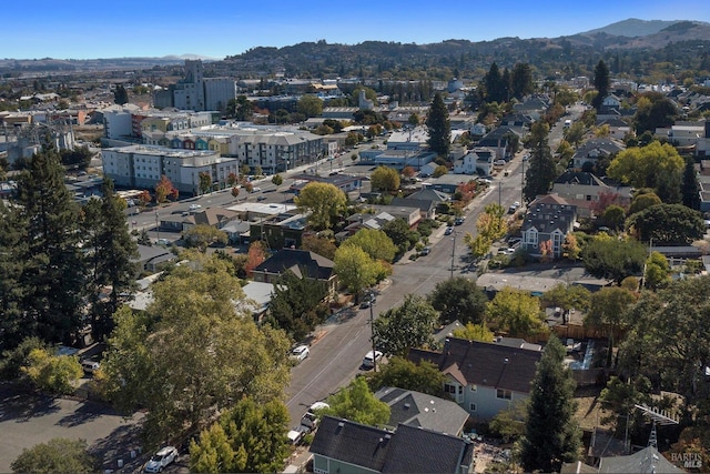 birds eye view of property with a mountain view