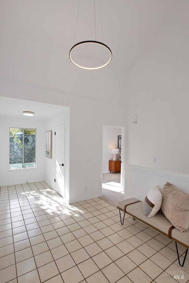 unfurnished living room featuring light tile patterned flooring