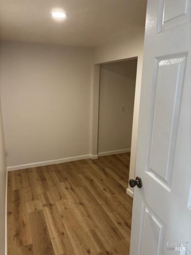 unfurnished room with light hardwood / wood-style floors