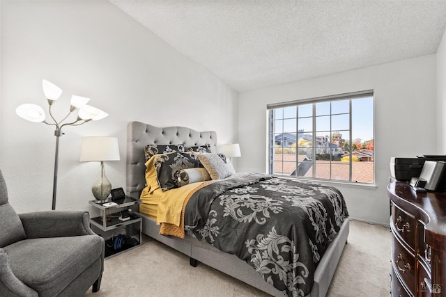 bedroom featuring light carpet, a textured ceiling, and an inviting chandelier