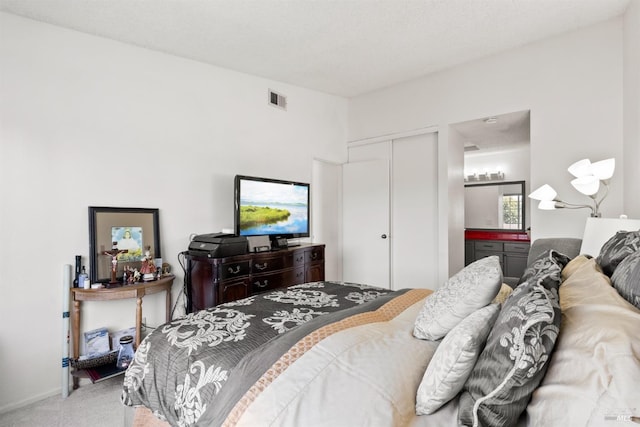 bedroom with a closet and carpet