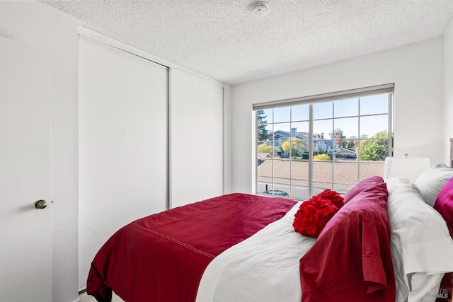 bedroom featuring a textured ceiling