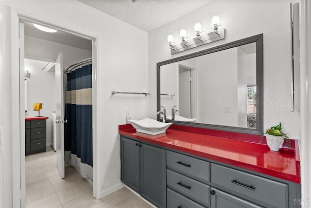 bathroom featuring vanity and a textured ceiling